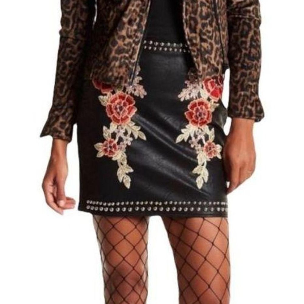 Romeo & Juliet Couture Embroidered faux-leather studded mini skirt.